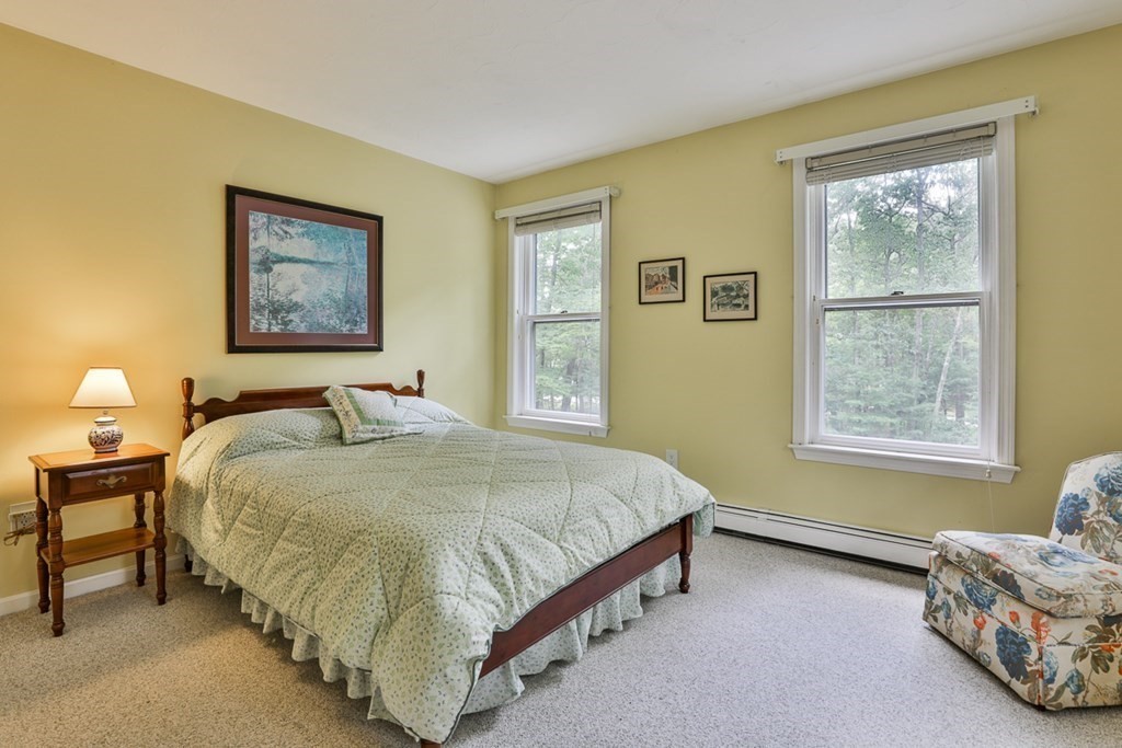 100 Stagecoach Road Lancaster, MA 01523 - Photo 18 of 29 a spacious bedroom with a bed and a window