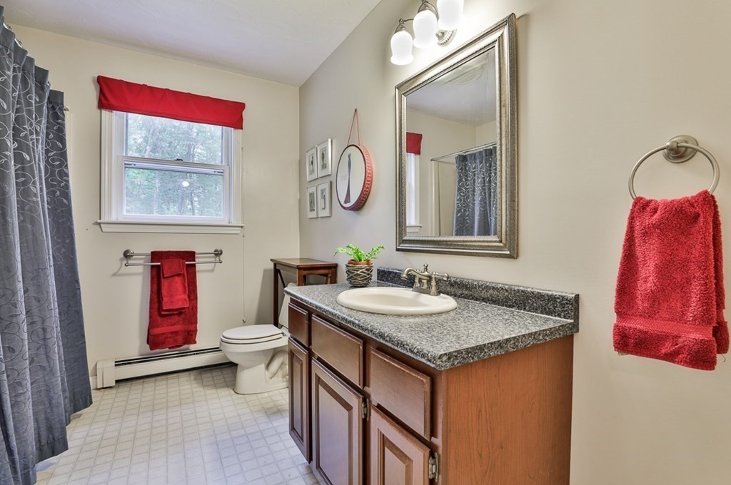 100 Stagecoach Road Lancaster, MA 01523 - Photo 19 of 29 a bathroom with a sink vanity and mirror