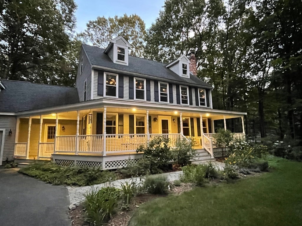 100 Stagecoach Road Lancaster, MA 01523 - Photo 2 of 29 a front view of a house with a yard and trees