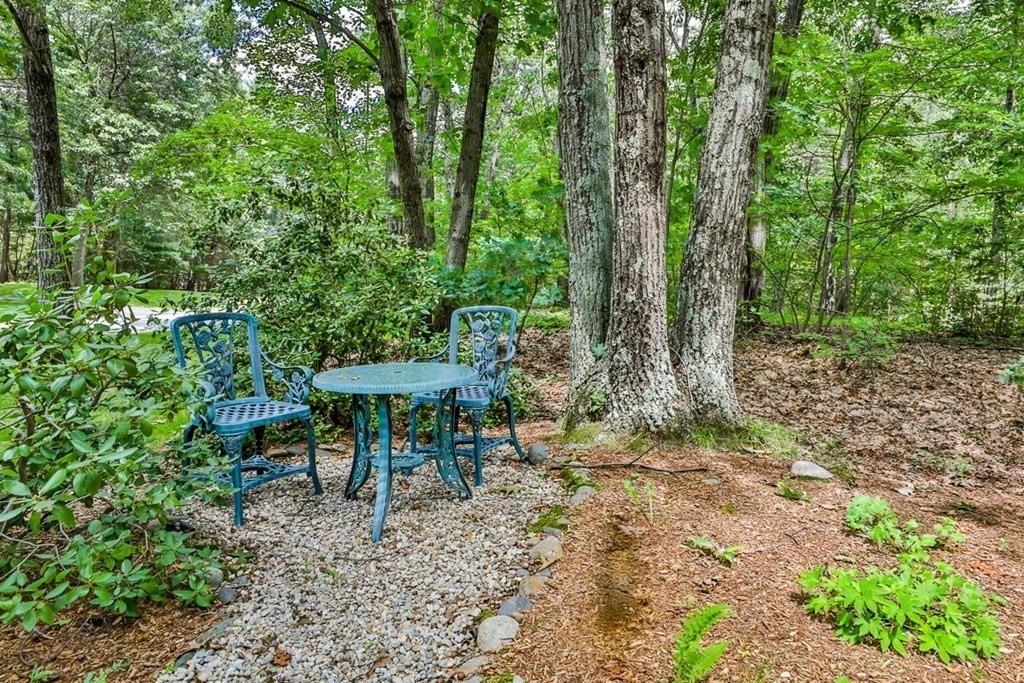 100 Stagecoach Road Lancaster, MA 01523 - Photo 25 of 29 a view of a table and chairs in the garden