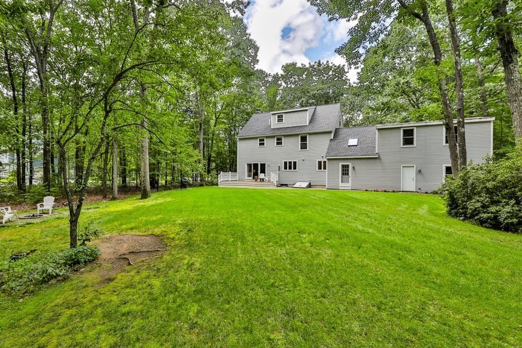 100 Stagecoach Road Lancaster, MA 01523 - Photo 26 of 29 a view of a house with backyard and a tree