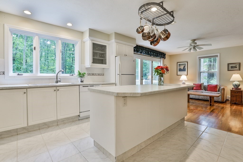 100 Stagecoach Road Lancaster, MA 01523 - Photo 5 of 29 a kitchen with a sink stove and cabinets