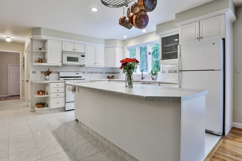 100 Stagecoach Road Lancaster, MA 01523 - Photo 6 of 29 a kitchen with stainless steel appliances a sink and a refrigerator