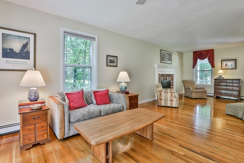 100 Stagecoach Road Lancaster, MA 01523 - Photo 9 of 29 a living room with furniture and wooden floor