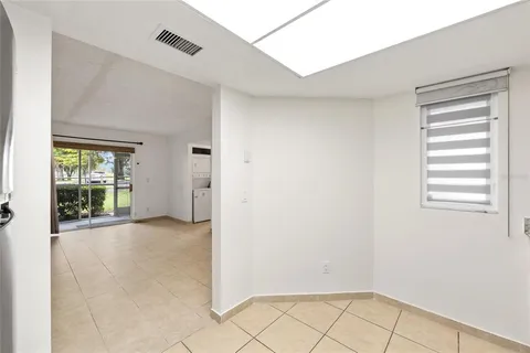 a kitchen with stainless steel appliances granite countertop a refrigerator sink and stove