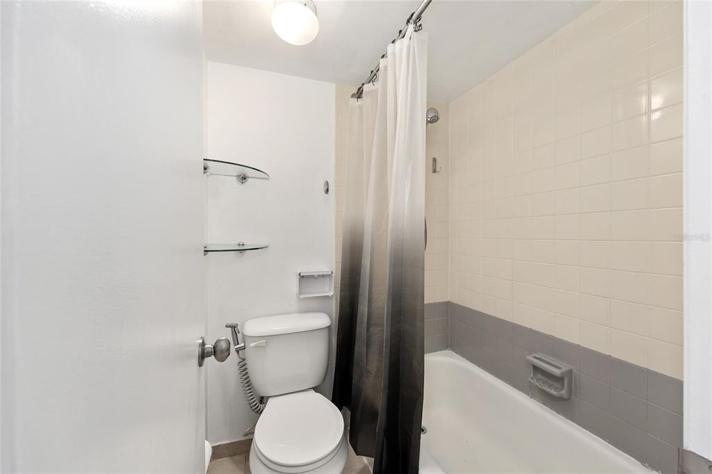 588 Fairways Lane, Unit E101 Ocala, FL 34472 - Photo 18 of 35 a white toilet sitting next to a bathroom sink