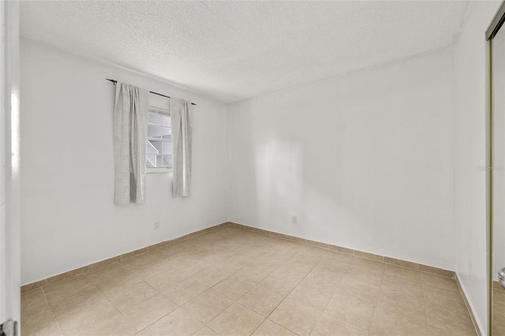 588 Fairways Lane, Unit E101 Ocala, FL 34472 - Photo 19 of 35 an empty room with windows