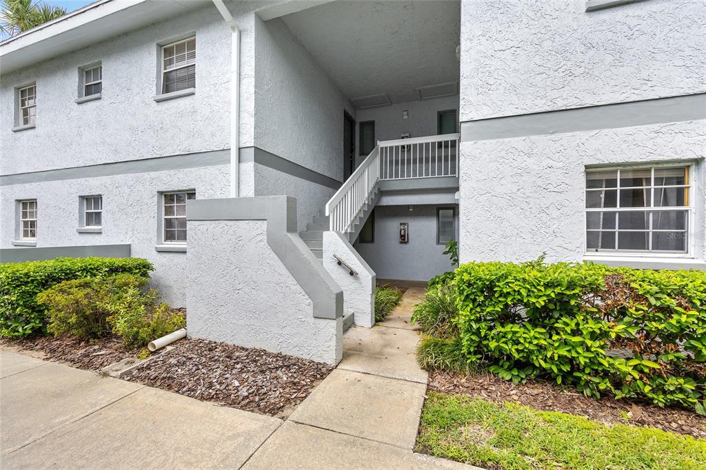 588 Fairways Lane, Unit E101 Ocala, FL 34472 - Photo 2 of 35 a front view of a house with garden