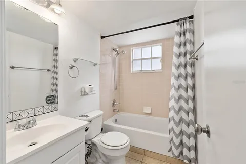 a view of an empty room and closet area