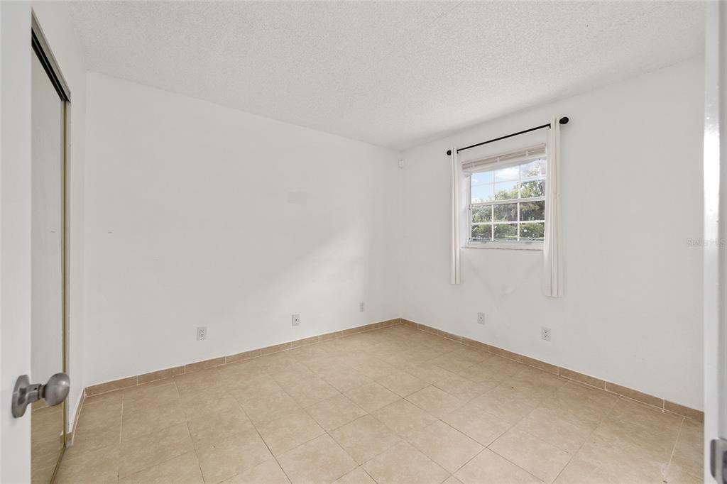 588 Fairways Lane, Unit E101 Ocala, FL 34472 - Photo 22 of 35 an empty room with a window