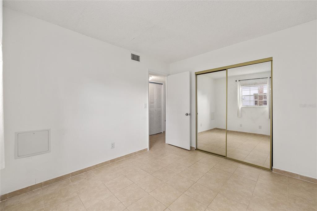 588 Fairways Lane, Unit E101 Ocala, FL 34472 - Photo 23 of 35 a view of an empty room and closet area