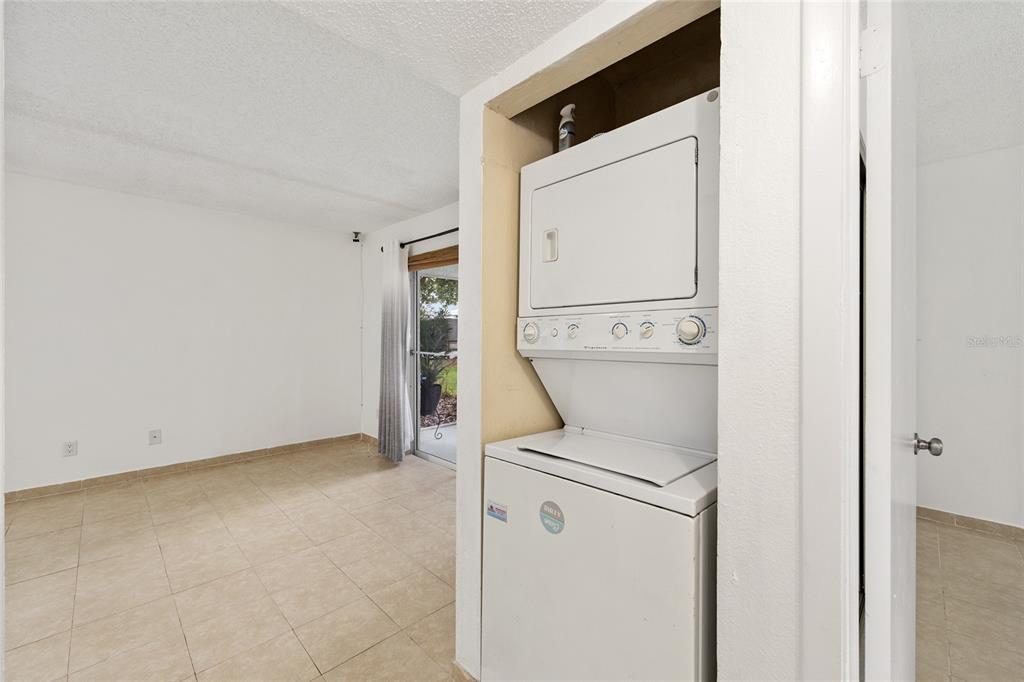 588 Fairways Lane, Unit E101 Ocala, FL 34472 - Photo 24 of 35 a utility room with dryer and washer