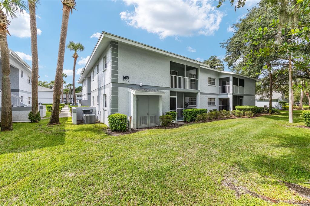 588 Fairways Lane, Unit E101 Ocala, FL 34472 - Photo 27 of 35 a view of a house with backyard and garden