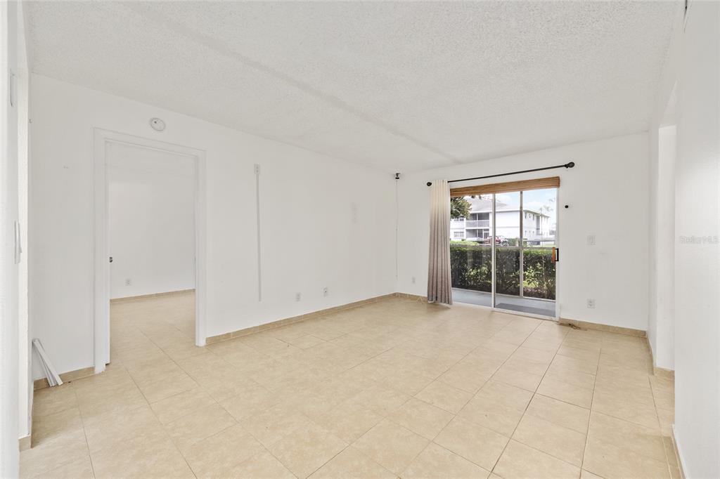 588 Fairways Lane, Unit E101 Ocala, FL 34472 - Photo 6 of 35 an empty room with windows