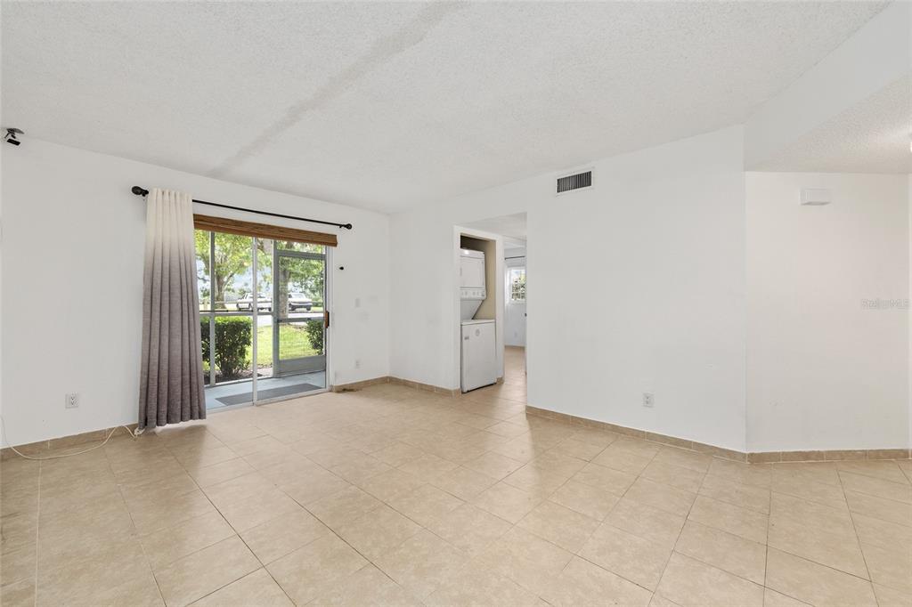 588 Fairways Lane, Unit E101 Ocala, FL 34472 - Photo 7 of 35 a view of an empty room with a window