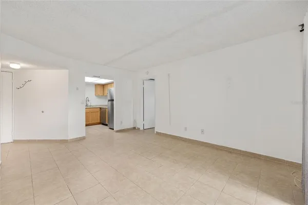 a kitchen with a stove a sink and a refrigerator