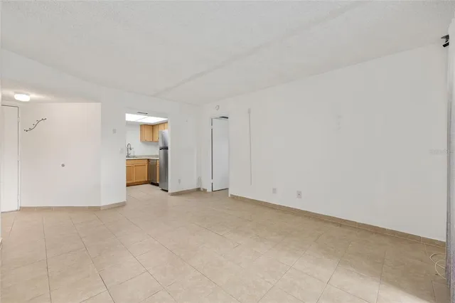 a kitchen with a stove a sink and a refrigerator