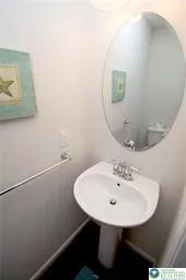 a bathroom with a sink a mirror and vanity
