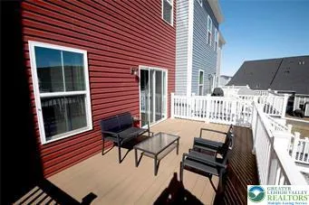 a view of a patio with a table and chairs