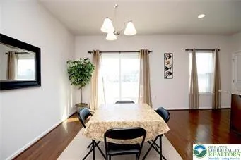 a view of a room with furniture window and wooden floor