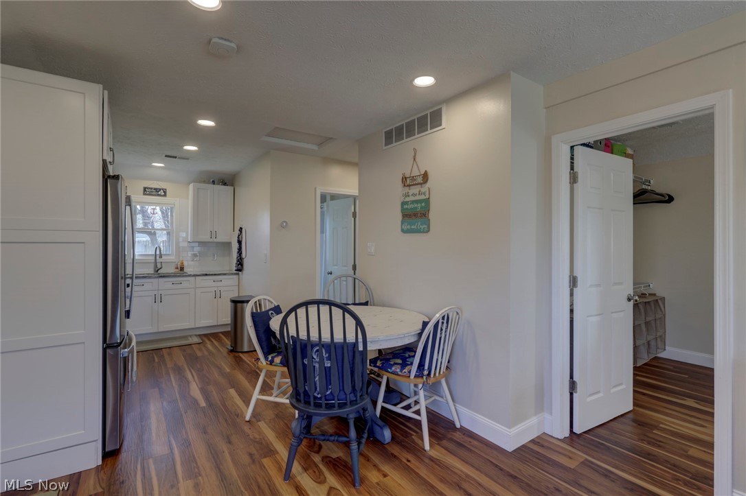 189 Harcourt Road Vermilion, OH 44089 - Photo 9 of 36 Dining room with dark wood-type flooring and recessed lighting