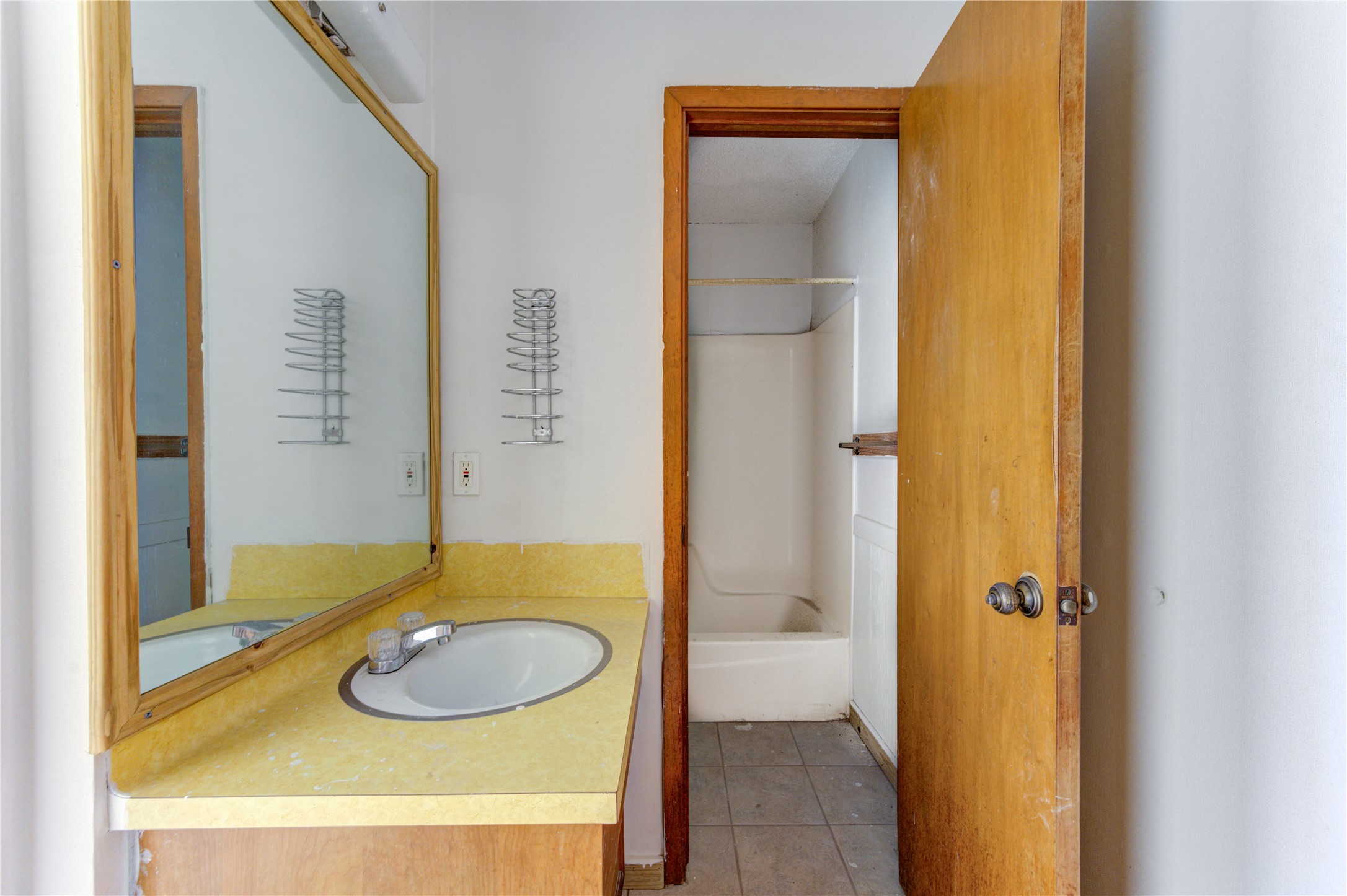 4602 Avenue H Rosenberg, TX 77471 - Photo 37 of 42 a bathroom with a sink and a mirror