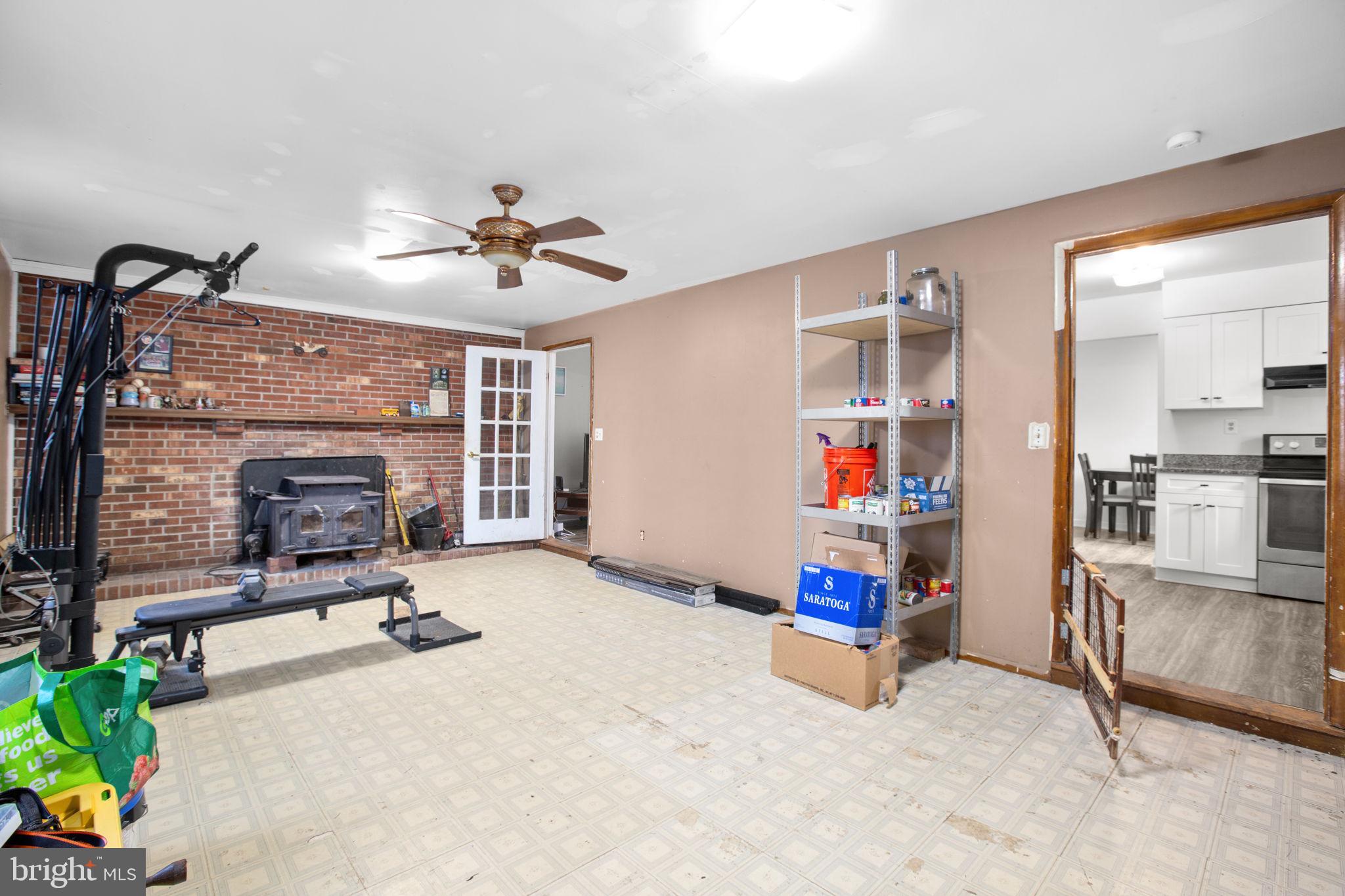 28494 Eddings Road Rhoadesville, VA 22542 - Photo 12 of 26 Wood stove and ceiling fan