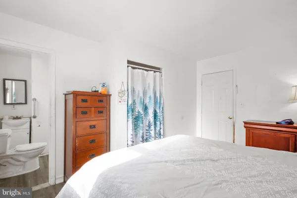 a bedroom with a bed and a closet