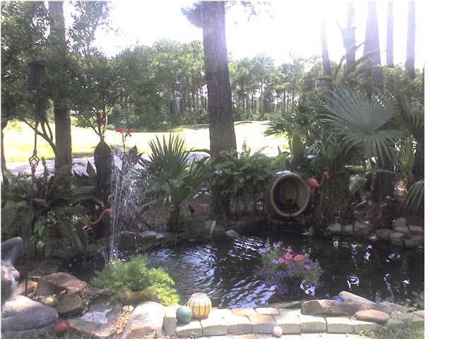 110 Indigo Loop Miramar Beach, FL 32550 - Photo 13 of 15 a backyard of a house with table and chairs