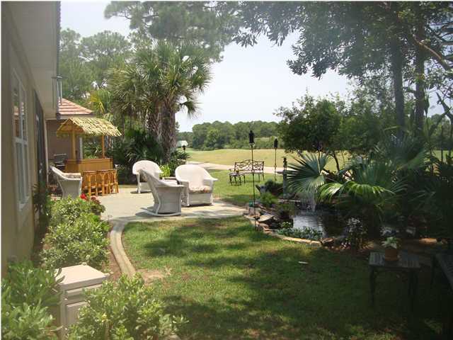 110 Indigo Loop Miramar Beach, FL 32550 - Photo 14 of 15 a view of a chair and table on the patio