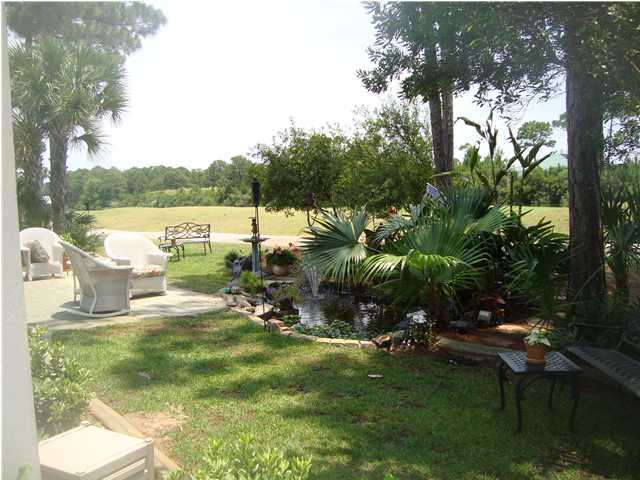 110 Indigo Loop Miramar Beach, FL 32550 - Photo 15 of 15 a view of a lake with a yard