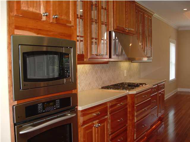 110 Indigo Loop Miramar Beach, FL 32550 - Photo 5 of 15 a kitchen with granite countertop a stove and a microwave
