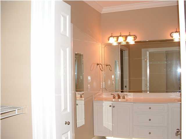 110 Indigo Loop Miramar Beach, FL 32550 - Photo 7 of 15 a bathroom with a double vanity sink and a mirror