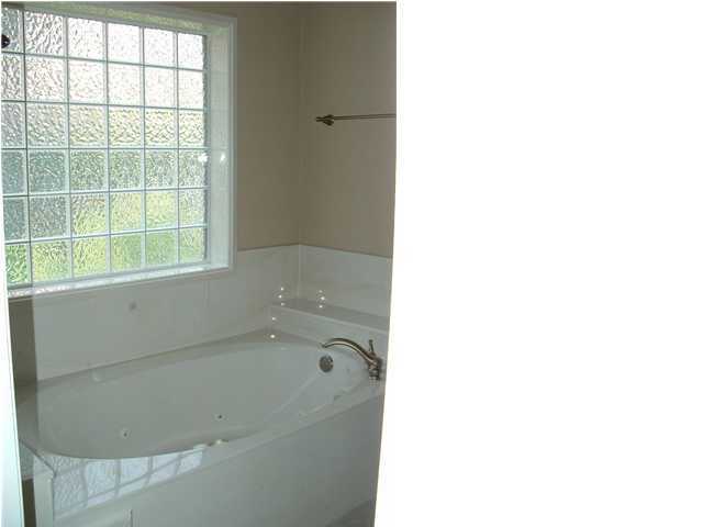 110 Indigo Loop Miramar Beach, FL 32550 - Photo 8 of 15 a white bath tub sitting next to a window