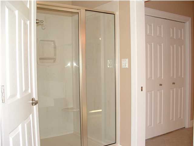 110 Indigo Loop Miramar Beach, FL 32550 - Photo 10 of 15 a bathroom with a glass shower door