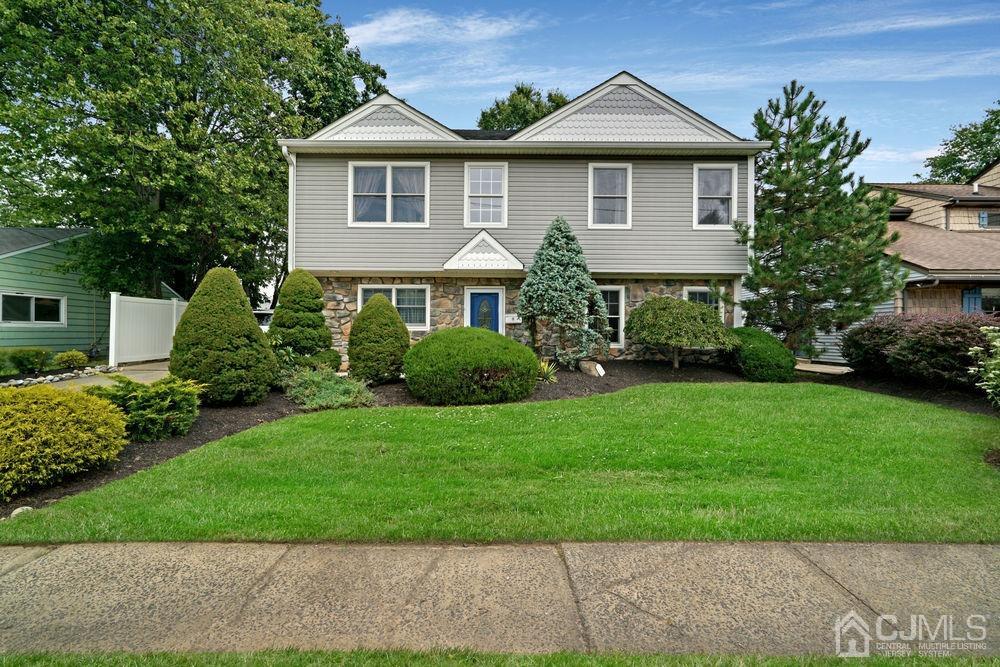 11 Kenmore Road Edison, NJ 08817 - Photo 1 of 40 a front view of a house with a yard