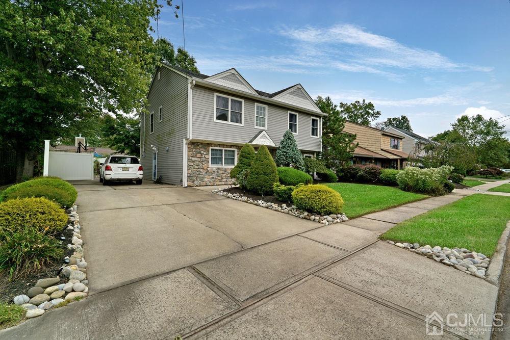 11 Kenmore Road Edison, NJ 08817 - Photo 2 of 40 front view of a house with a garden
