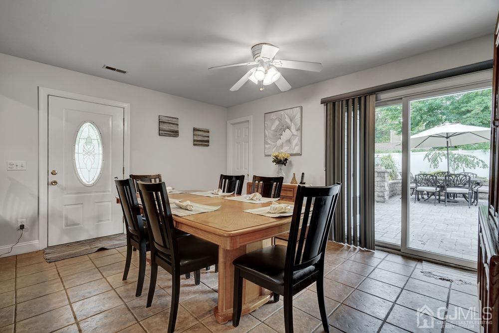 11 Kenmore Road Edison, NJ 08817 - Photo 13 of 40 a view of a dining room with furniture and chandelier