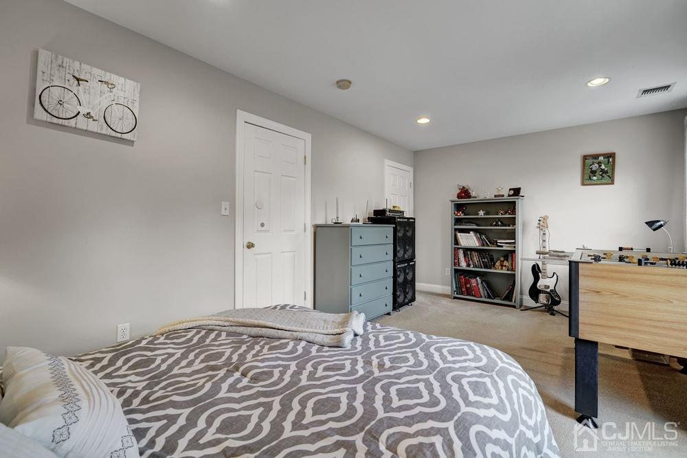 11 Kenmore Road Edison, NJ 08817 - Photo 17 of 40 a bedroom with a bed and a television