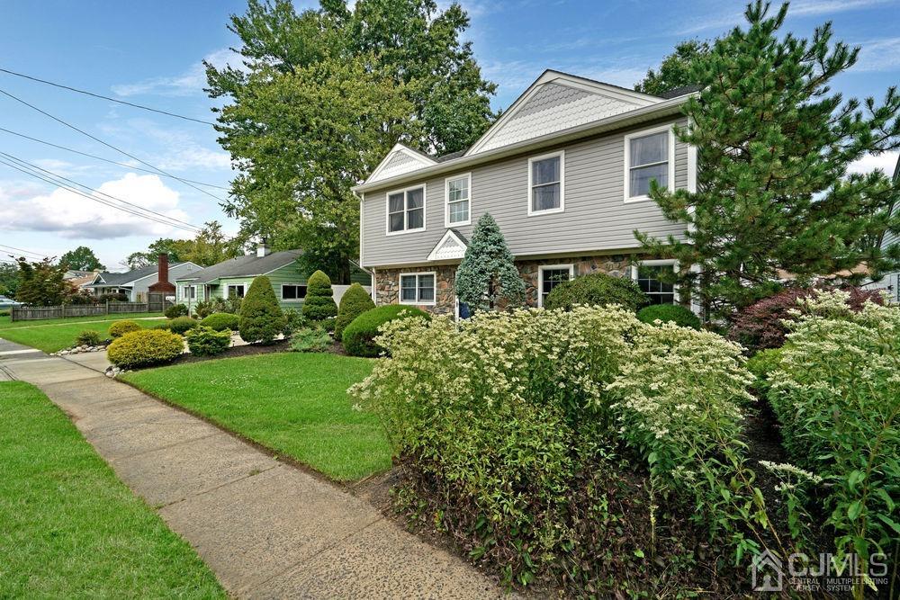 11 Kenmore Road Edison, NJ 08817 - Photo 3 of 40 a front view of a house with a yard