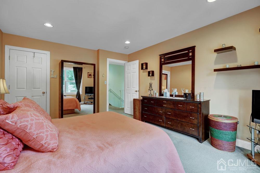 11 Kenmore Road Edison, NJ 08817 - Photo 21 of 40 a bedroom with a bed and a dresser