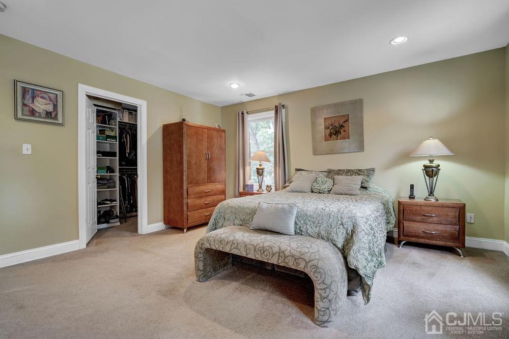 11 Kenmore Road Edison, NJ 08817 - Photo 26 of 40 a spacious bedroom with a bed and a cabinets
