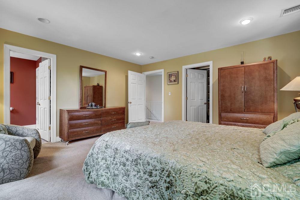 11 Kenmore Road Edison, NJ 08817 - Photo 28 of 40 a bedroom with a bed and a dresser