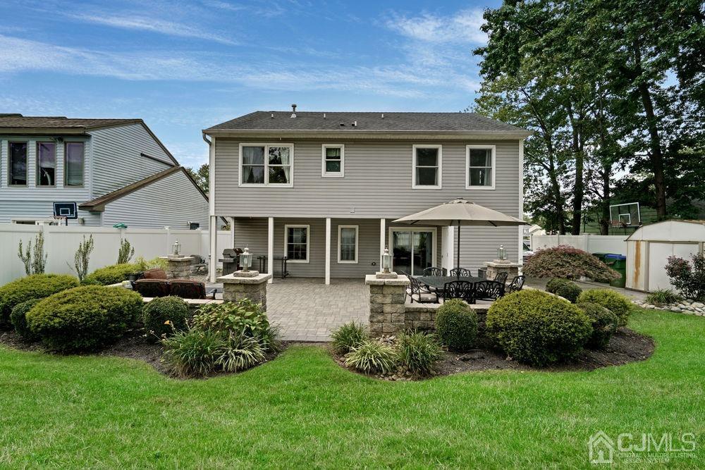 11 Kenmore Road Edison, NJ 08817 - Photo 34 of 40 a front view of a house with a garden and sitting area