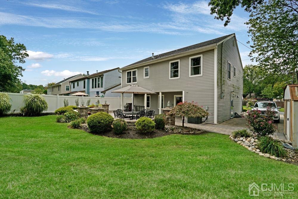 11 Kenmore Road Edison, NJ 08817 - Photo 35 of 40 a front view of a house with a garden and patio