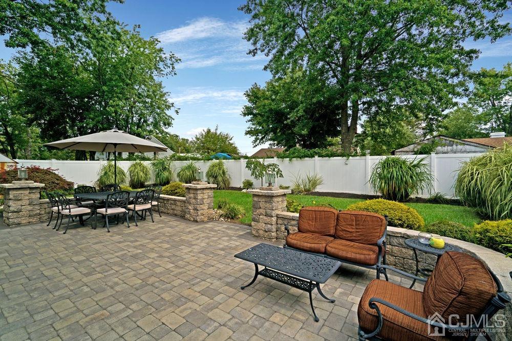 11 Kenmore Road Edison, NJ 08817 - Photo 37 of 40 an outdoor sitting area with furniture and garden view