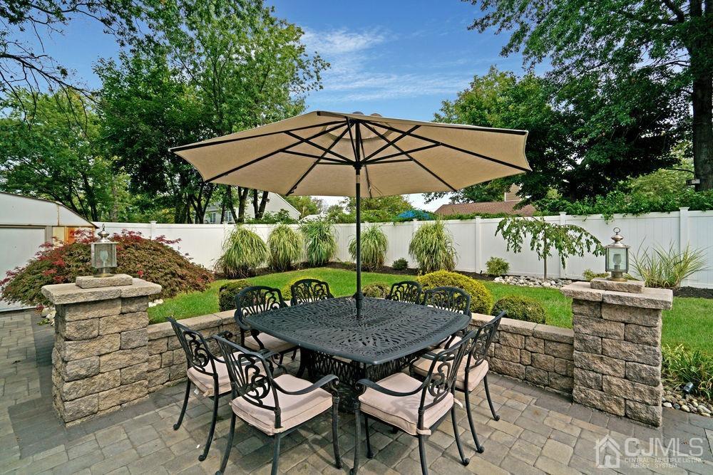 11 Kenmore Road Edison, NJ 08817 - Photo 38 of 40 a view of an outdoor sitting area with furniture