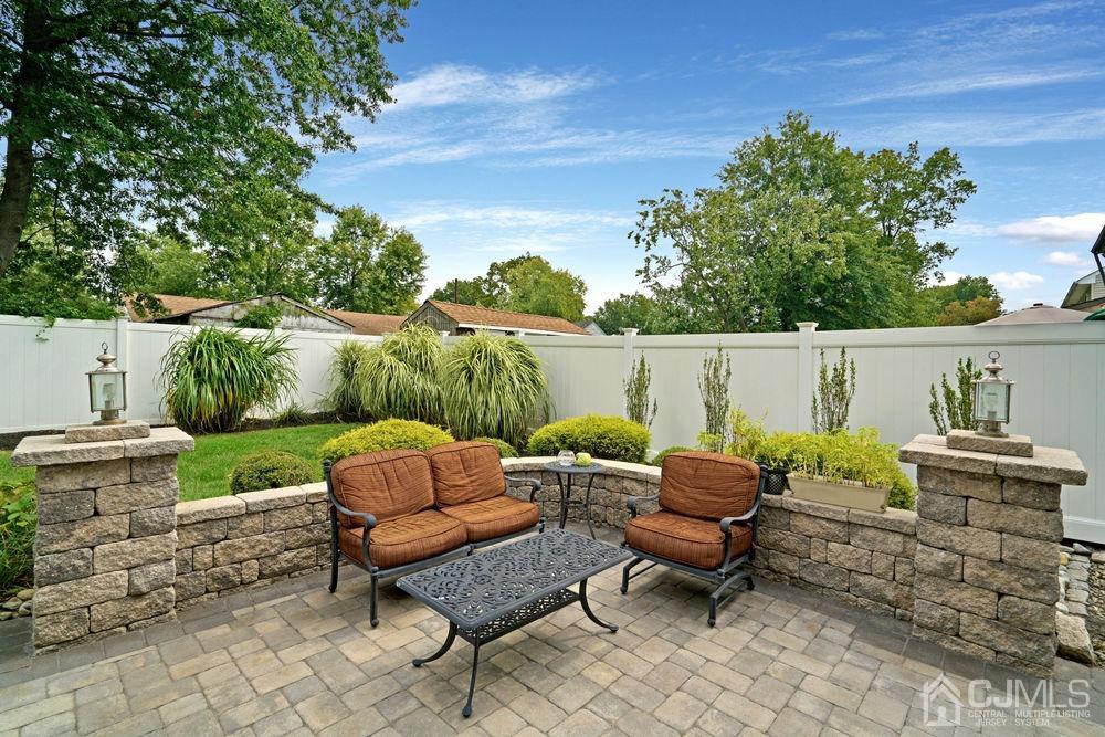 11 Kenmore Road Edison, NJ 08817 - Photo 39 of 40 a chairs and a table in the patio