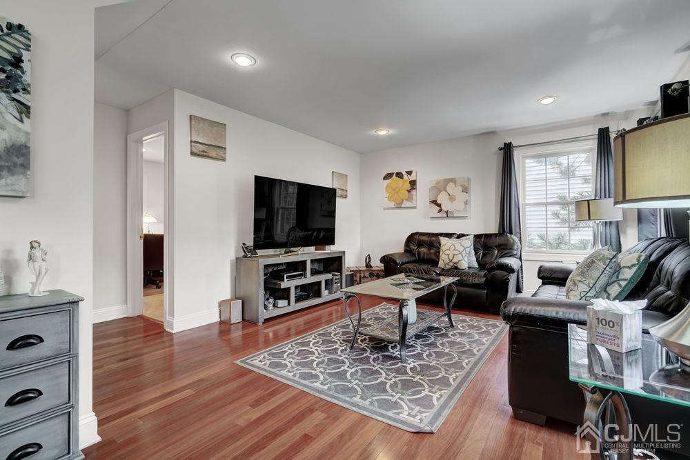 11 Kenmore Road Edison, NJ 08817 - Photo 5 of 40 a living room with furniture and a flat screen tv