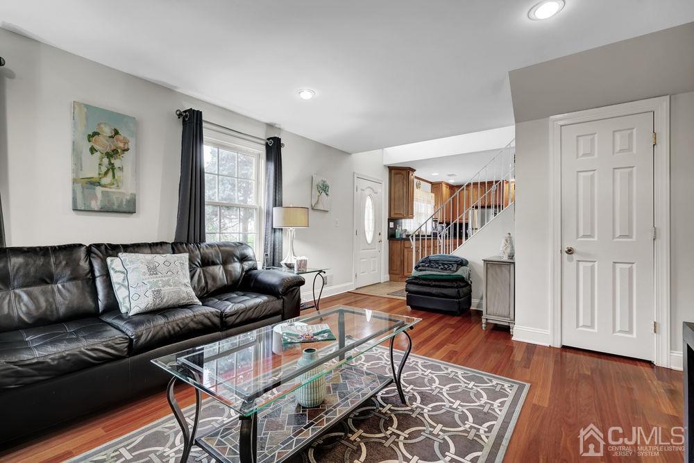 11 Kenmore Road Edison, NJ 08817 - Photo 7 of 40 a living room with furniture and wooden floor